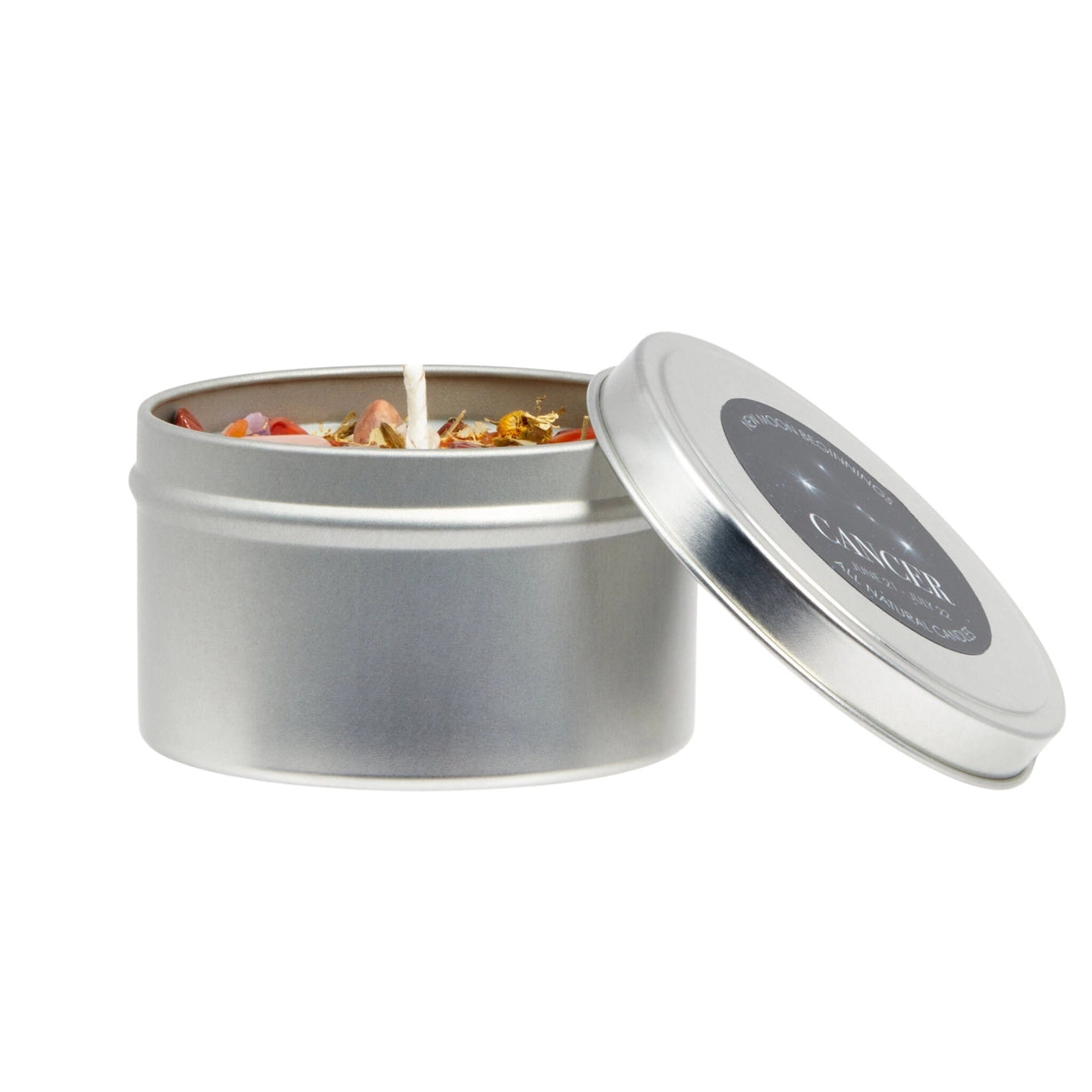Silver tin candle with floral elements on a white background
