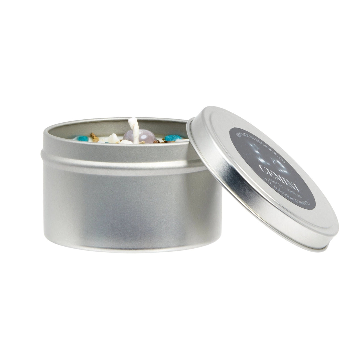 Silver candle tin with lid open on a white background