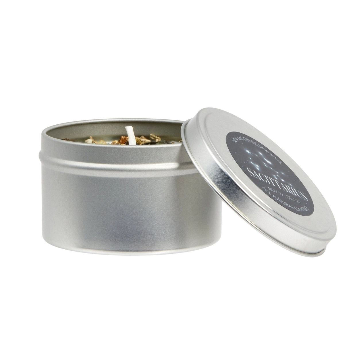 Silver candle tin with a lit candle inside on a white background