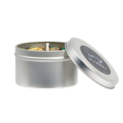Silver candle tin with a candle inside, labeled 'Scorpio', on a white background