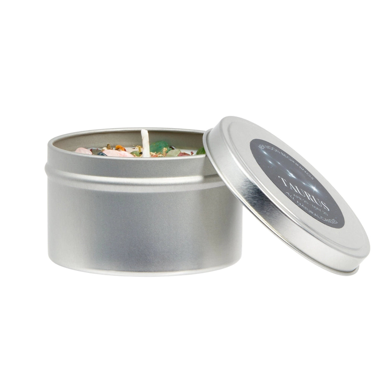 Silver candle tin with a lit candle inside on a white background